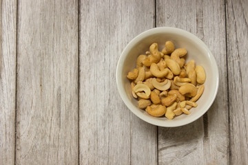 Cashew nuts on a wooden table