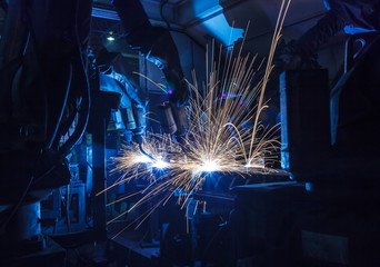 Welding robots movement in a car factory