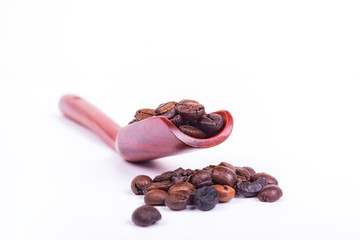 selective focus coffee beans and Wooden Spoon coffee a backgroun