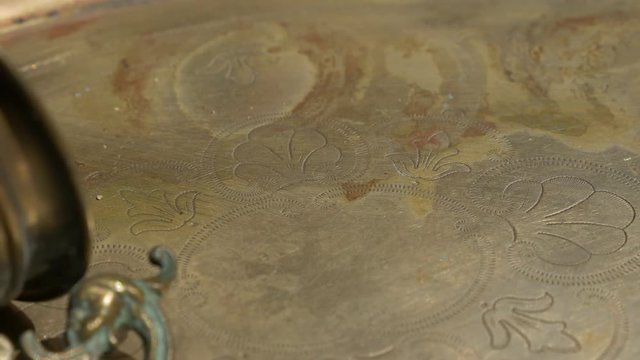  Ancient brass plate beautiful texture and grail 4K UHD 2160p footage - Ancient hand made plate close up panning with beautiful patina in 4K 3840X2160 UHD resolution
