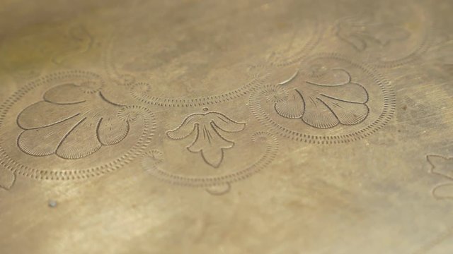 Ancient brass plate with beautiful texture in 4K UHD 2160p footage - Ancient hand made plate with beautiful patina in 4K 3840X2160 UHD resolution