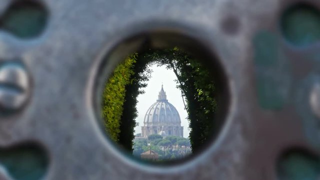 st.peter cathedral dome as seen from the famous hole of rome at Knights of Malta at cavalieri of malta square