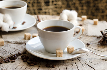 two cups coffee wooden stump