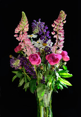 bouquet of summer flowers on black