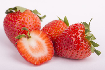  strawberries close up on white background