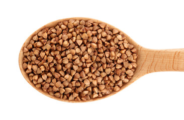 Wooden spoon with buckwheat isolated on white background.