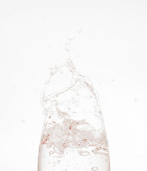 water splash from glass on white background