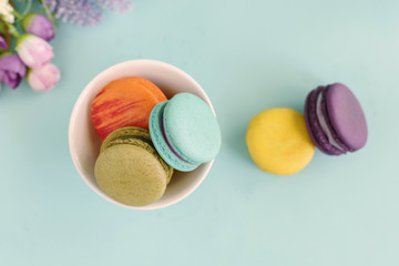 Colorful macaroons and a cup of coffee