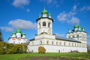 Fototapeta na wymiar Bell Tower and the Church of St. John the Evangelist in Vyazhishchsky Monastery, sunny october afternoon. Novgorod region, Russia