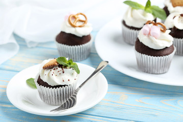 Chocolate cupcakes on a blue wooden table