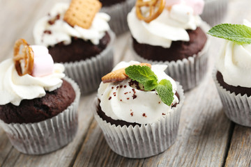 Chocolate cupcakes on a grey wooden table