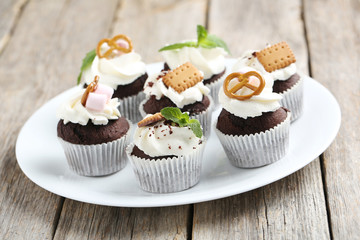Chocolate cupcakes on a grey wooden table