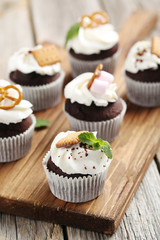 Chocolate cupcakes on a grey wooden table