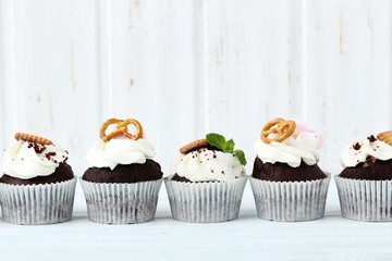 Chocolate cupcakes on a blue wooden table