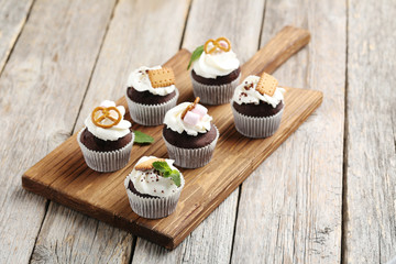 Chocolate cupcakes on a grey wooden table