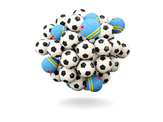 Pile of footballs with flag of aruba