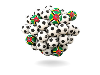 Pile of footballs with flag of dominica