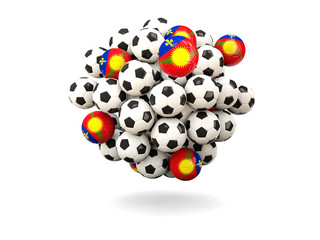 Pile of footballs with flag of guadeloupe