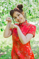 Beautiful asian girl in traditional chinese red dress.