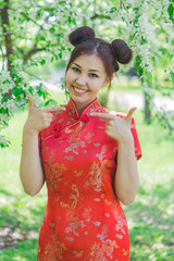 Beautiful asian girl in traditional chinese red dress.