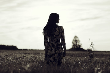 black and white photo of the girl in a field freedom