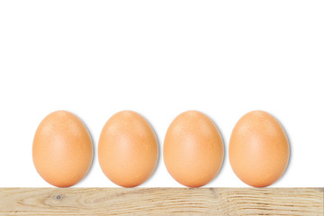 Fresh eggs with soft shadow on wooden vintage floor on white background