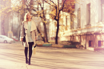 Autumn portrait of happy girl on a walk