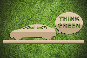 Paper cut of eco on green grass