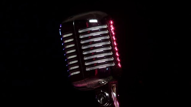 Classic Vocal Microphone slow rotating and reflects stage lights 