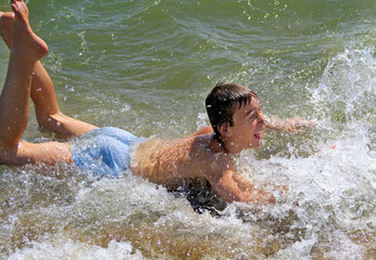 Teenager bathing in the Sea