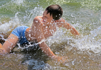 Teenager bathing in the Sea