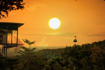 Cable car on the  mountain sunset background