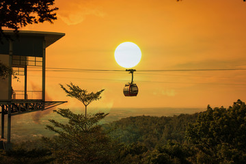 Cable car on the  mountain sunset background