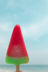 Watermelon ice-cream summer time on sea beach.
In summer season, it's very good to have some colorful watermelon ice cream to refresh and cool down hot weather. Good time on vacation at sea beach.