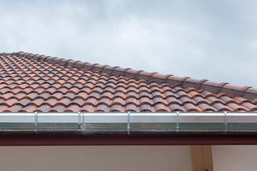 gutter roof on house in rainy day