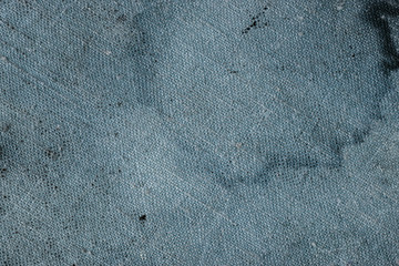 Stained fragment of textured fabric