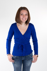 Woman wearing blue top and jeans isolated