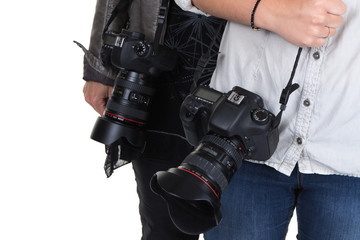 Image of two women holding camera in studio
