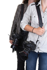 Cropped image of two women holding camera in studio