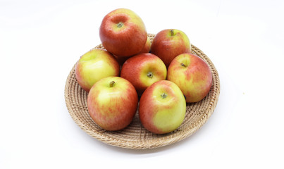 Ripe apple on the craft basket