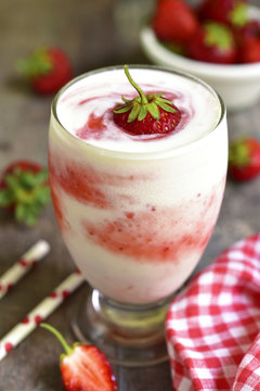Vanilla milkshake with strawberry.