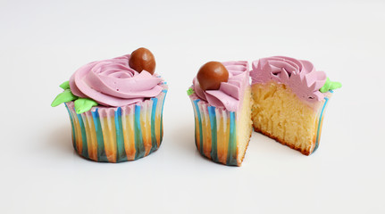 two purple cupcake on a white background