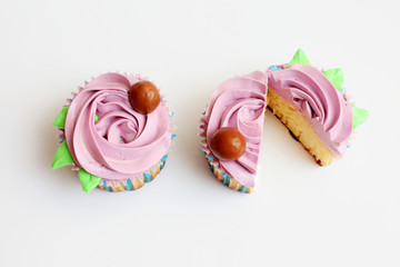 two purple cupcake on a white background