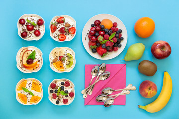 Six yogurts ready to eat and ingredients.