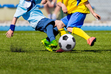 Boys kids children kicking soccer football ball. Young soccer football players