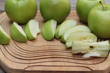 green apples is delicious on wood background.