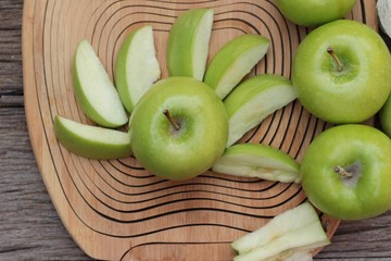 green apples is delicious on wood background.