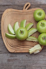 green apples is delicious on wood background.
