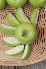 green apples is delicious on wood background.