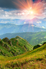 Sunny summer scene in the mountains with blue sky.